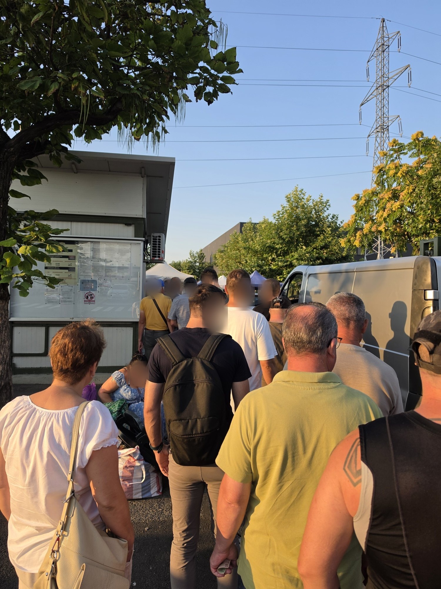 Visitors queuing at the ticket booth of the Valea Cascadelor flea market in Bucharest early on a Saturday morning